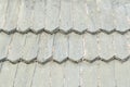 Old roof is made of wooden tiles. Texture. Close-up Royalty Free Stock Photo