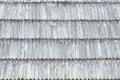 Old roof is made of wooden tiles. Texture. Close-up Royalty Free Stock Photo