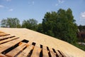 Old roof renovation, frame of the roof covered with wooden OSB boards