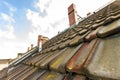 Old roof with roofing tiles and chimneys Royalty Free Stock Photo