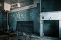 An old room in an abandoned building. Blue walls.