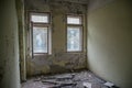 Old room with broken windows at the abandoned building in the Chernobyl ghost town