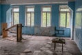 Old room with broken windows and tables at the abandoned building in the Chernobyl ghost town