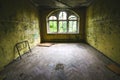 An old room with destroyed windows in an abandoned place Royalty Free Stock Photo