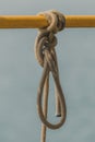 Old rope tied to a knot Royalty Free Stock Photo