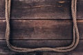 Old rope on wood plank background Royalty Free Stock Photo