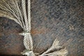 Old Ropes with U-Bolt Clamp on a rusty metal background Royalty Free Stock Photo