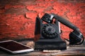 Old rotary telephone alongside a tablet computer Royalty Free Stock Photo