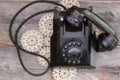 Old rotary telephone with the handset off the hook Royalty Free Stock Photo