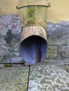 old and rotten drainage pipe of the building in the summer. Royalty Free Stock Photo