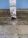 old and rotten drainage pipe of the building in the summer. Royalty Free Stock Photo