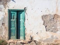 Old rotten house with a wooden green door Royalty Free Stock Photo