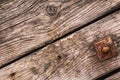 Old Rotten Planks With Rusty Nails And Square Washer With Nut Royalty Free Stock Photo