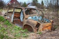 The old, rotten, rusty destroyed car Royalty Free Stock Photo