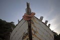 Old rotten wooden ship with paint peeling off