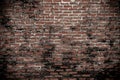 Old rough dirty grunge brick wall with black stain pattern texture background