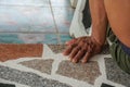 old rough men left hand sit on the cement bench Royalty Free Stock Photo