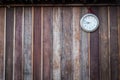 Old round clock hang on old wooden wall Royalty Free Stock Photo