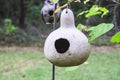 An old round hand made bird feeder