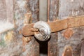 Old round padlock on rusty door Royalty Free Stock Photo