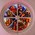 Old round stained glass window in a destroyed in the church, bright colors Royalty Free Stock Photo