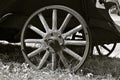 Old wooden wagon wheel with spokes Royalty Free Stock Photo