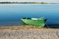 Old row boat on the beach. Sunrise. Royalty Free Stock Photo