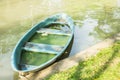 Old rowboat in canal, plastic rowboat