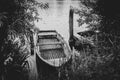 Old rowboat is moored on the shore of a lake Royalty Free Stock Photo