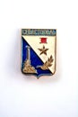 Old rubbed vintage badge. Coat of arms of Sevastopol