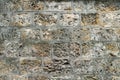 Old and rugged wall fencing the river Seine