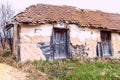 Old ruin abandoned farmhouse. Front view. Rural landscape. Daylight Royalty Free Stock Photo