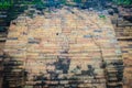 Old ruin brick wall covered with green moss and small grass. Old khmer sanctuary brick wall overgrown with green moss. Royalty Free Stock Photo