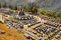 Old ruin of a Greek temple in Delphi with tourists. 06/07/2013 - Delphi, Greece. Stock picture