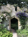 Old ruin turned into a secret garden with arched doorway Royalty Free Stock Photo
