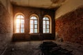 Old ruined abandoned mansion interior, vaulted windows Royalty Free Stock Photo