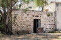 Old ruined abandoned stone building on one of the quiet side streets near the main pedestrian HaMeyasdim in Zikhron Yaakov city Royalty Free Stock Photo