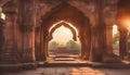 Old ruined arch in ancient temple at sunset in India Royalty Free Stock Photo