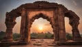 Old ruined arch in ancient temple at sunset in India Royalty Free Stock Photo