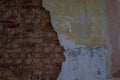 The old and ruined brick wall with plaster, lost places Royalty Free Stock Photo