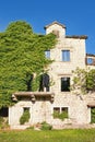 Old ruined building overgrown with green ivy Royalty Free Stock Photo