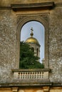 Old ruined domed window with gold domed church wrest park, west midlands