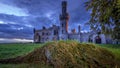 Old ruined Duckett Grove castle with tree roots and stormy sky Royalty Free Stock Photo