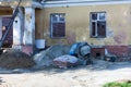 Old and ruined house at the daylight. Abandoned old home with destructed walls.