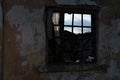 Old ruined house. Wall with a window as background and texture