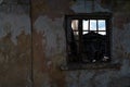 Old ruined house. Wall with a window as background and texture