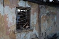 Old ruined house. Wall with a window as background and texture