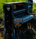 Destroyed piano sitting outside Royalty Free Stock Photo