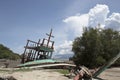 An old ruined sailboat abandoned in the beach