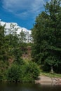 An old ruined staircase to an abandoned castle standing on a hilltop in the woods next to the river a